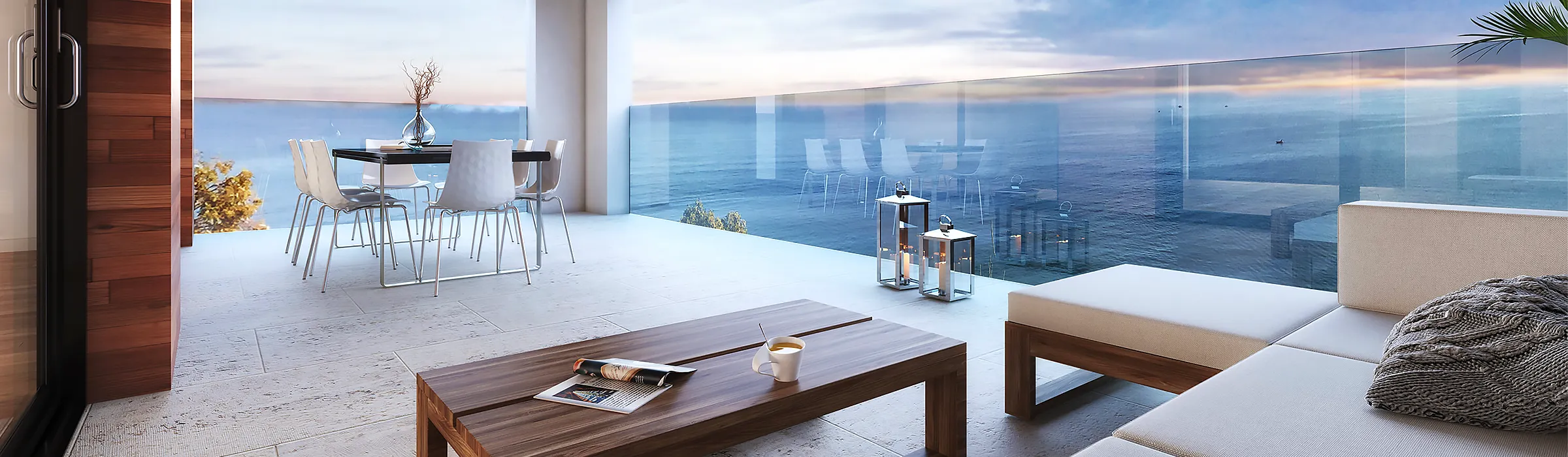 Naples, Florida condominium balcony with a dining table and lounge seating overlooking the sea