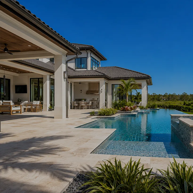 Infinity-edge pool and covered lanai at a luxury home in Bonita Bay, Bonita Springs, Florida
