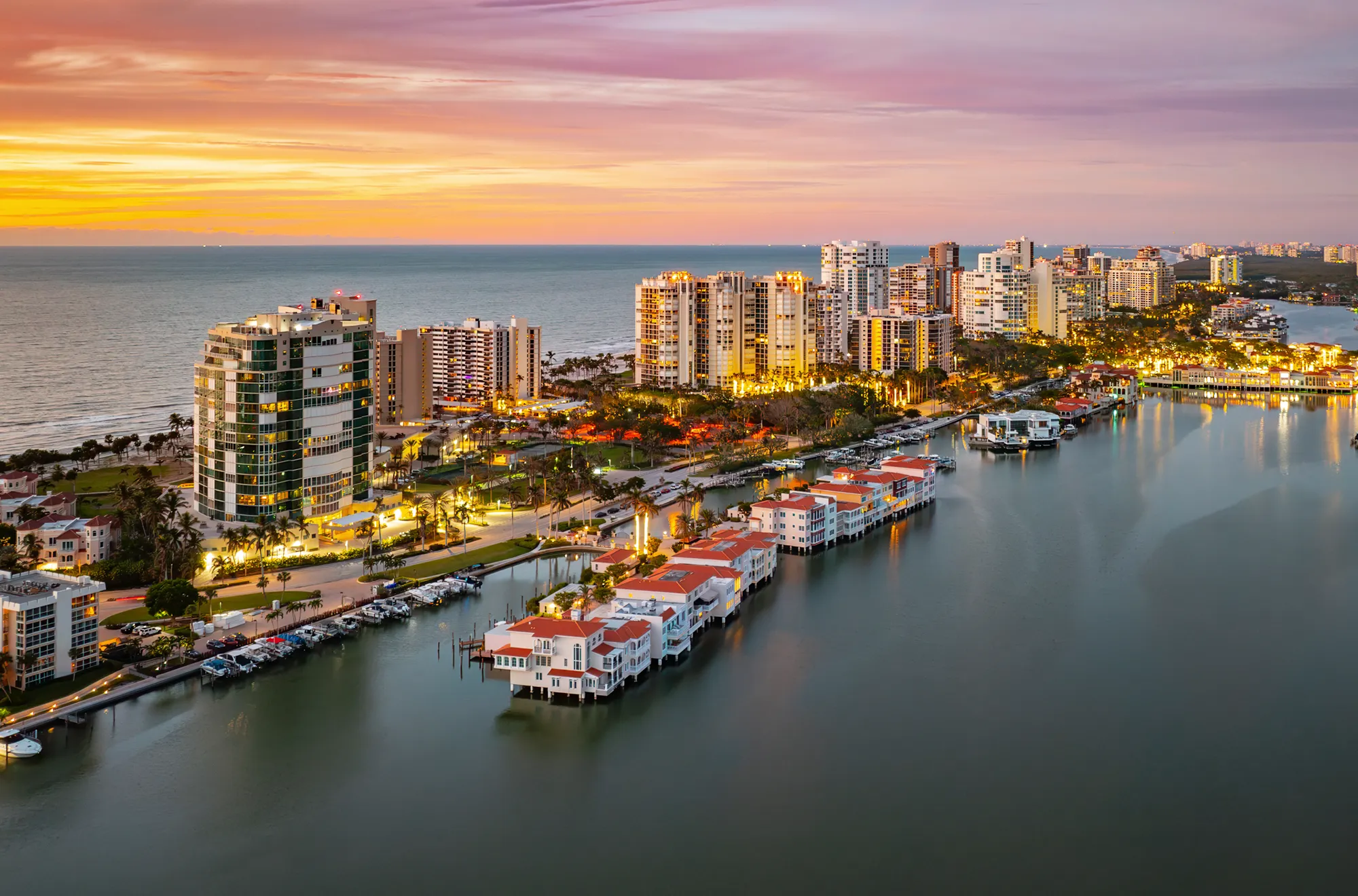 Condominium towers along the Gulf of Mexico beside the bay in Park Shore, Naples, Florida, at dusk