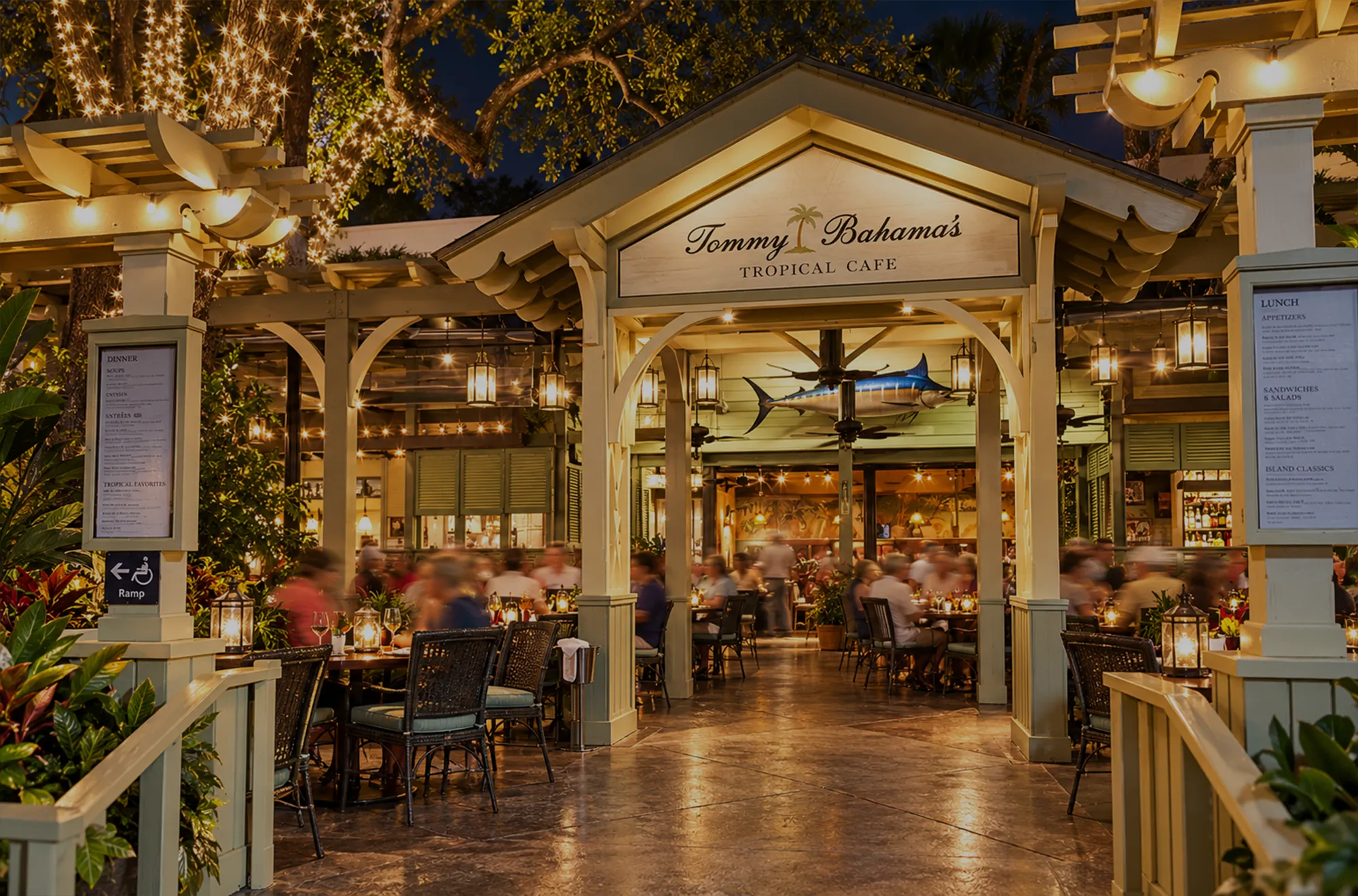 Courtyard dining under string lights at the Tommy Bahama restaurant on Third Street South, a short walk from Aqualane Shores, Naples, Florida