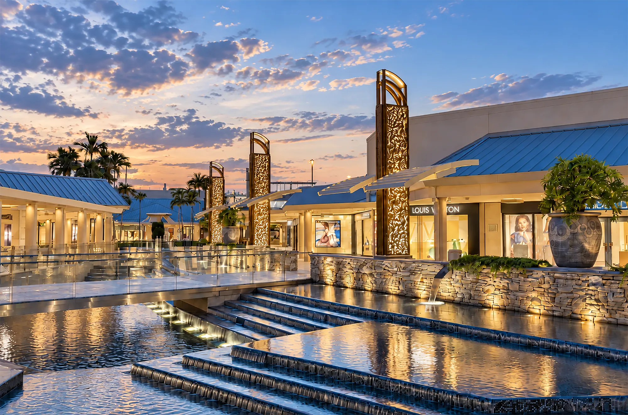 Designer boutiques and water features at Waterside Shops, a short drive from Bay Colony in Pelican Bay, Naples, Florida